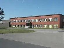 A long, two-storey brick building.