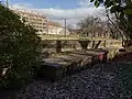 The retaining wall by the Ördög-árok stream buried in a recess