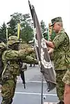 Return of the Ranger flag in the completion ceremony