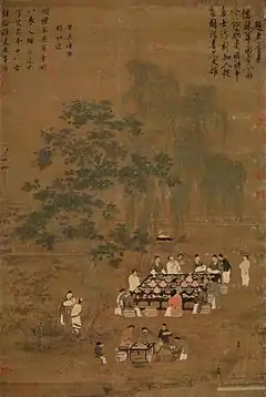 Twelve people gather around an outdoor table decorated with a black tablecloth, several potted plants, and dozens and dozens of small dishes. Most of the people are talking with one another. Off to the side a servant stands watching, and in the bottom of the painting four people are crowded around a smaller table set up as a staging area for the preparation of tea.