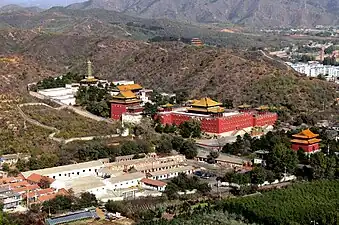 Bird's eye view of Xumi Fushou Temple from top of a hill in the Mountain Resort