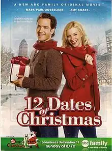 Miles (Mark-Paul Gosselaar) and Kate (Amy Smart) standing outside in winter; Miles is holding a wrapped present