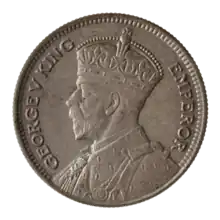 A coin featuring a crowned bust of King George V