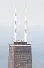 John Hancock Center in 1974, with the original striped paint scheme visible on its antenna towers