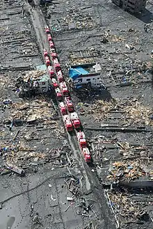 Emergency vehicles staging in the ruins of Otsuchi, Japan following the tsunami