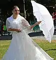 A dancer wearing a modern traje de mestiza at the 2015 Richmond Filipino Festival