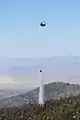 Helicopter dropping water near Angel Peak on July 1