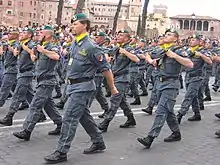 Uniformed agents marching in a parade