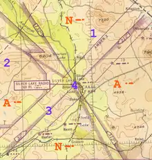 Map showing primarily four thick lines emanating from a center point into four directions, defining four quadrants; the upper and lower quadrants are marked with the letter 'N' and the left and right ones with 'A'; each letter is followed by its Morse code; also, there is a digit "1" in the top quadrant, "2" in the left, and "3" on the line separating the bottom and left quadrants