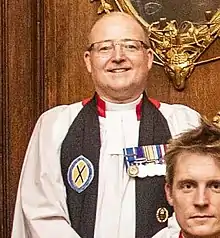 Clinton Langston in choir dress with medals