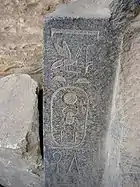 Frosted hieroglyphs and cartouche shown on medium-gray and white stone, Egypt of Pharaoh Senusret I