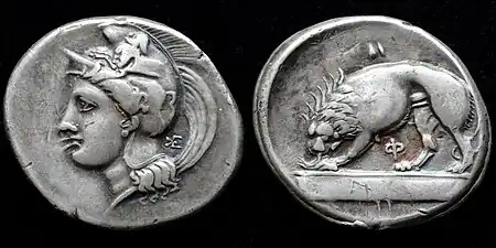 Silver stater struck in Velia 334-300 BC depicting Athena wearing a Phrygian helmet decorated with a centaur and lion devouring prey