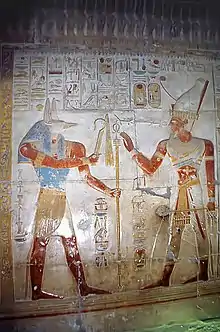 Wepwawet giving scepters to Seti I, bas-relief from the Temple of Seti I