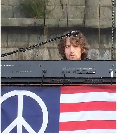 Adam MacDougall performing with The Black Crowes at the 2008 Newport Folk Festival.