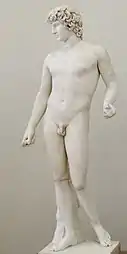 Antinous standing in contrapposto, with a support behind his right leg