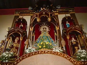 Our Lady of Salambao and saints Baylon (lower left) and Claire of Assisi (lower right) in the altar