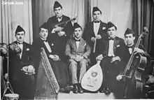 Image 29Iraqi music group led by Yusuf Za'arur in Baghdad, wearing the   sidara, ca 1930. (from Music of Iraq)