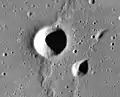 Aratus D (center) and probable collapse features to the east, associated with a small rille (arrows)