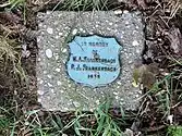 Contributing structures and markers on the green, tree marker