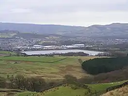 Image of a reservoir surrounded by fields and hills