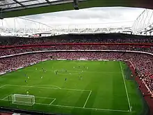 A near-capacity crowd watch Arsenal play Real Madrid on the second and final day of the pre-season tournament.