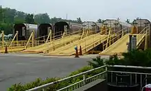 Autoracks lined up at their loading ramps