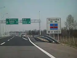 Directional traffic signs placed on a gantry and next to the A3 motorway