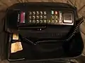 Motorola Digital Concert Bag Phone with color LCD display, in upright bag.