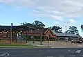 Station front and bus interchange in April 2011