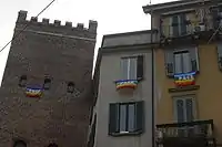 "Pace da tutti i balconi": peace flags hanging from windows in Milan, Italy, in March 2003. Over 1,000,000 were hung against the Iraq war.