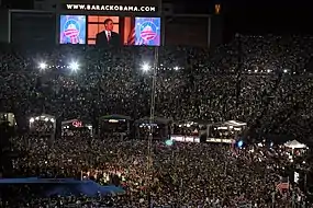 (C) The above-described four-teleprompter set-up in use at the 2008 Democratic National Convention in Denver, Colorado, USA (the large confidence monitor under the TV cameras is near the bottom far right of this frame).