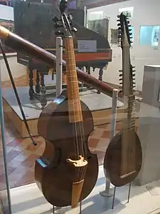 At left: bass gamba made by Gaspar Borbon of Brussels, 1697; at right: theorbo