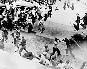 Teamsters clash with armed police during a Minneapolis 1934 strike.