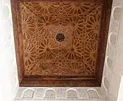 Geometric patterns in a wooden ceiling in the Ben Youssef Madrasa in Marrakesh