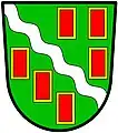 a bendlet—Vert; a bendlet wavy argent between six billets gules, each fimbriated or—Stroud Urban District Council, England