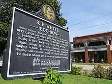 A historic marker in the town square commemorates the life and legacy of renowned shape note-singer and songwriter B.F. White.