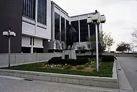 The statue amid landscaping, c. 1974