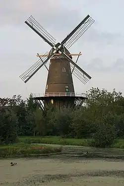 Wind mill in the middle of some bushes