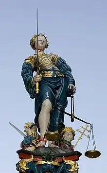 Lady Justice with sword, scales and blindfold on the Gerechtigkeitsbrunnen in Bern, Switzerland—1543