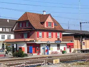 Three-story building with half-hipped roof