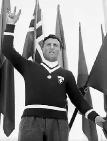 Black and white photo of Torriani reciting the Olympic oath at the start of the 1948 Winter Olympic Games in St. Moritz