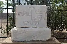 large stone grave marker with several names on it