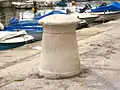 Old stone bollard, once used to moor the large vessels