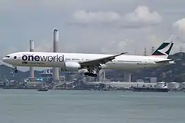 A Boeing 777-300ER (B-KPL) in Oneworld special livery.