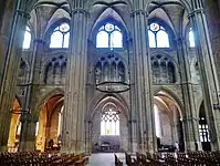 The alternating pillars of the nave. The collateral aisles are in the background.