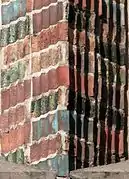 Glazed shaped tiles on the south gable