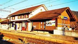 Two-story station building with single-story wings