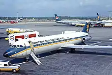 Plane on tarmac, with other planes in the background