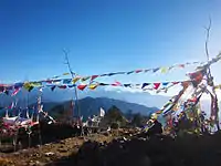 Buddhist prayer flags fluttering inside Pathibhara Devi Temple premises