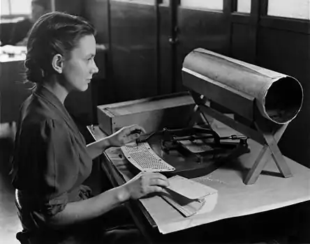 Image 13KeypunchPicture: Unknown; restoration: MmxxA woman using a Hollerith pantograph, a machine developed by Herman Hollerith for the punching of cards, providing data which could then be processed. Such tools were used in the 1890 United States Census, the first time the country's census was tabulated by machine.More selected pictures